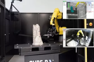 Robot z&nbsp;głowicą skanującą w&nbsp;komórce CUBE-R; podgląd trajektorii skanowania na ekranach